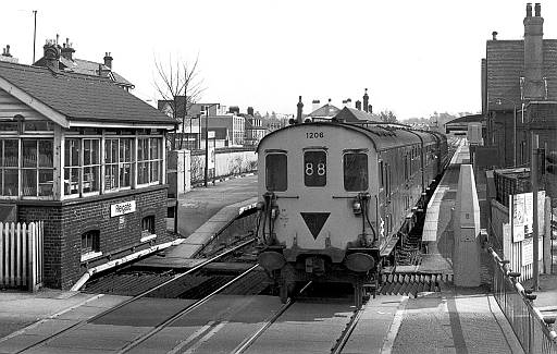 [PHOTO: Train at station and level-crossing: 36kB]