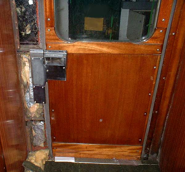 [PHOTO: interior view of train door with modifications: 50kB]