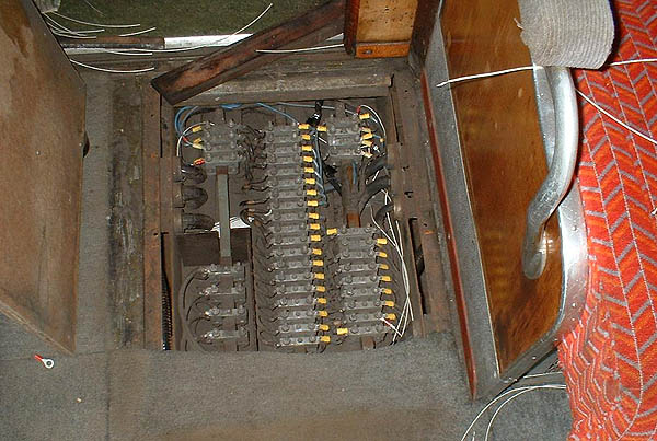 [PHOTO: train floor with hatch removed, wiring exposed; 70kB]