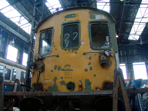 [PHOTO: close-up of carriage front undergoing repair: 53kB]