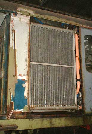 [PHOTO: large radiator fitted in bodyside of motor coach: 25kB]