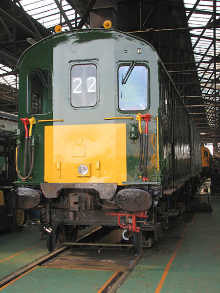 [PHOTO: Train in depot sheds: 56kB]