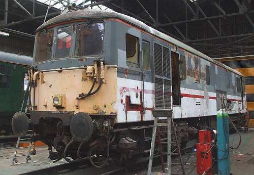 [PHOTO: loco undergoing body overhaul in depot: 34kB]