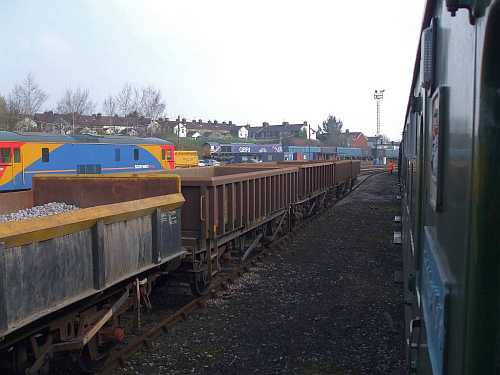 [PHOTO: On-train view of railway yard: 20kB]