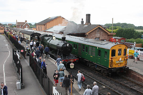 [PHOTO: Steam and diesel trains at station: 66kB]