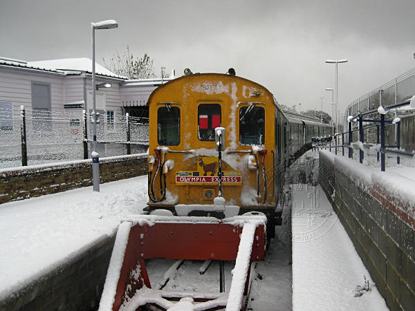 [PHOTO: Train at buffers in snow: 52kB]