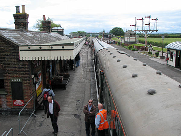 [PHOTO: Preserved station with train: 50kB]