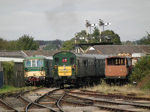 [PHOTO: Trains and signal-gantry: 52kB]