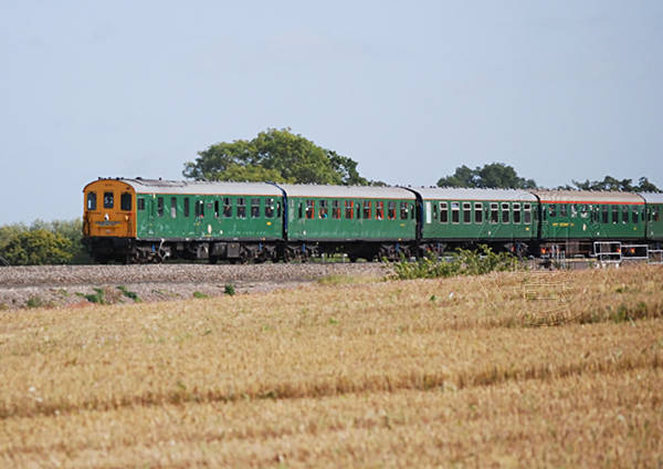 [PHOTO: Train passing through countryside: 42kB]