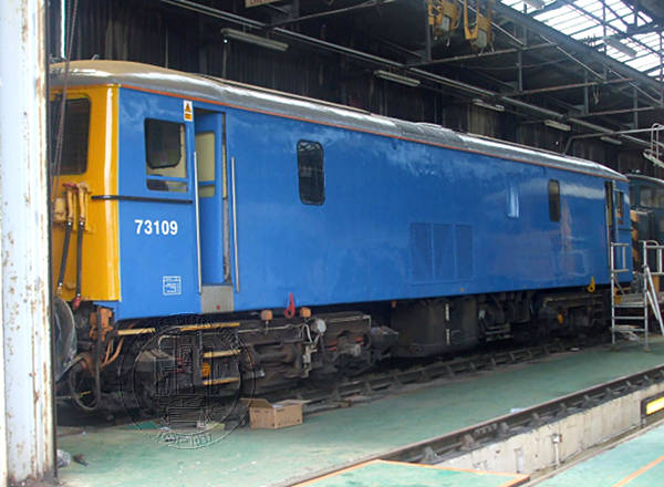 [PHOTO: Locomotive in depot trainshed: 52kB]